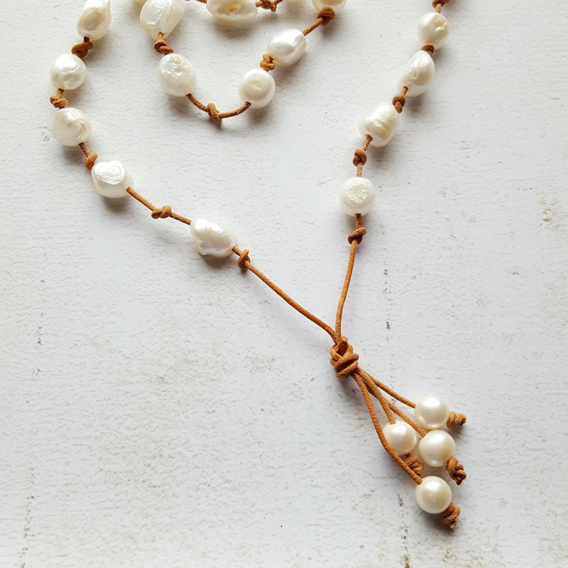Baroque White Pearl knotted onto natural tan Leather necklace