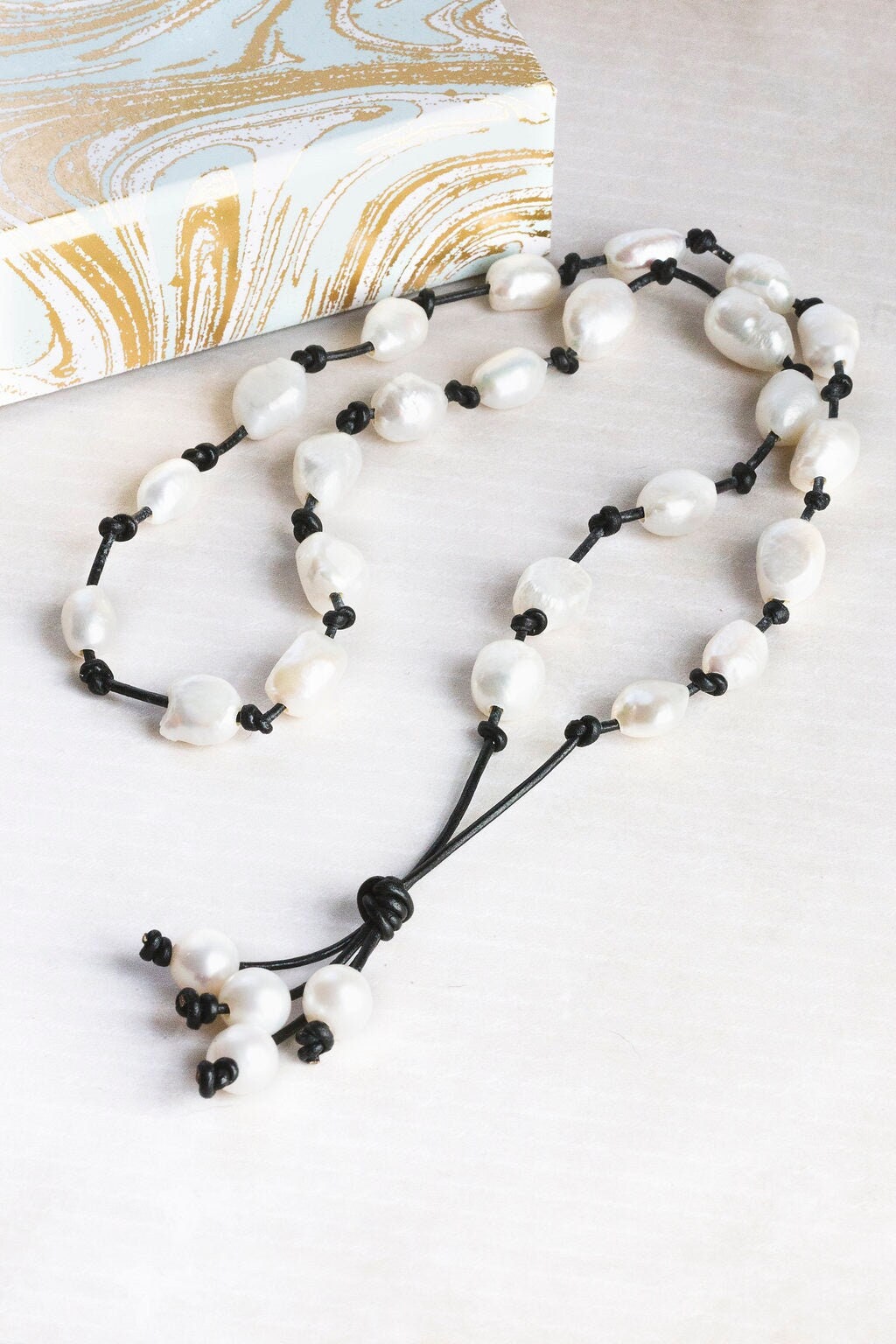 Baroque White Pearl knotted onto natural tan Leather necklace