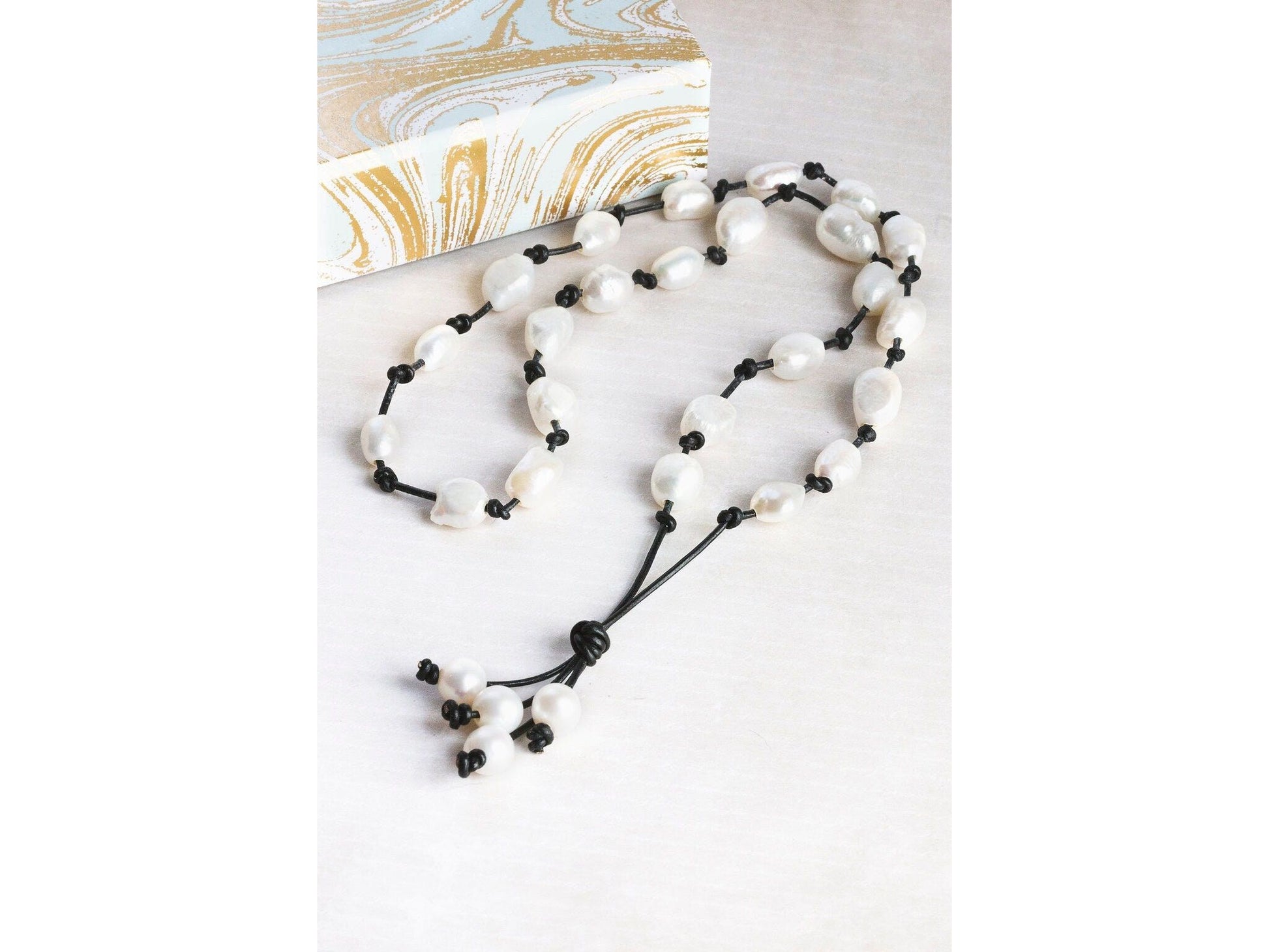 Baroque White Pearl knotted onto natural tan Leather necklace