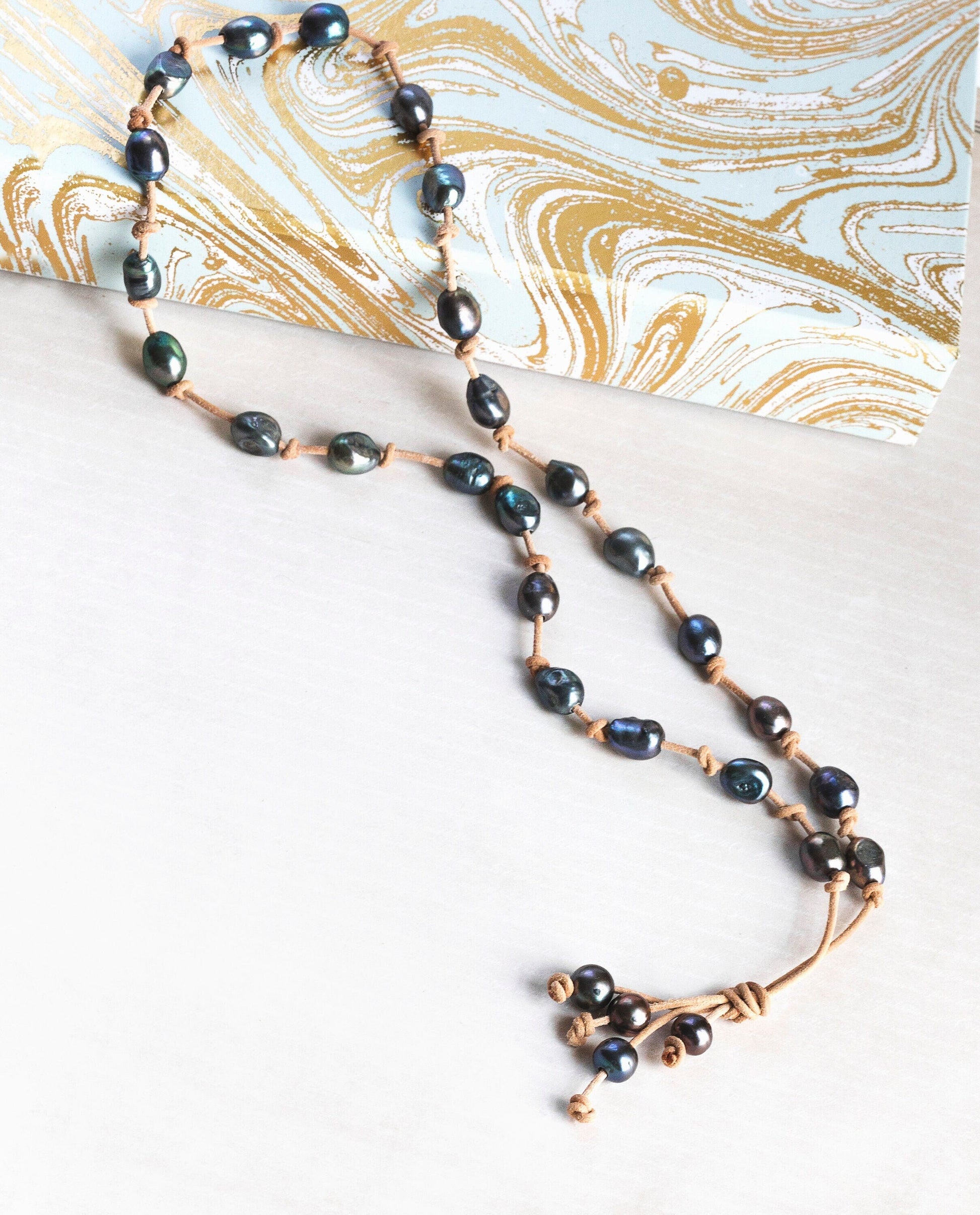 Baroque White Pearl knotted onto natural tan Leather necklace