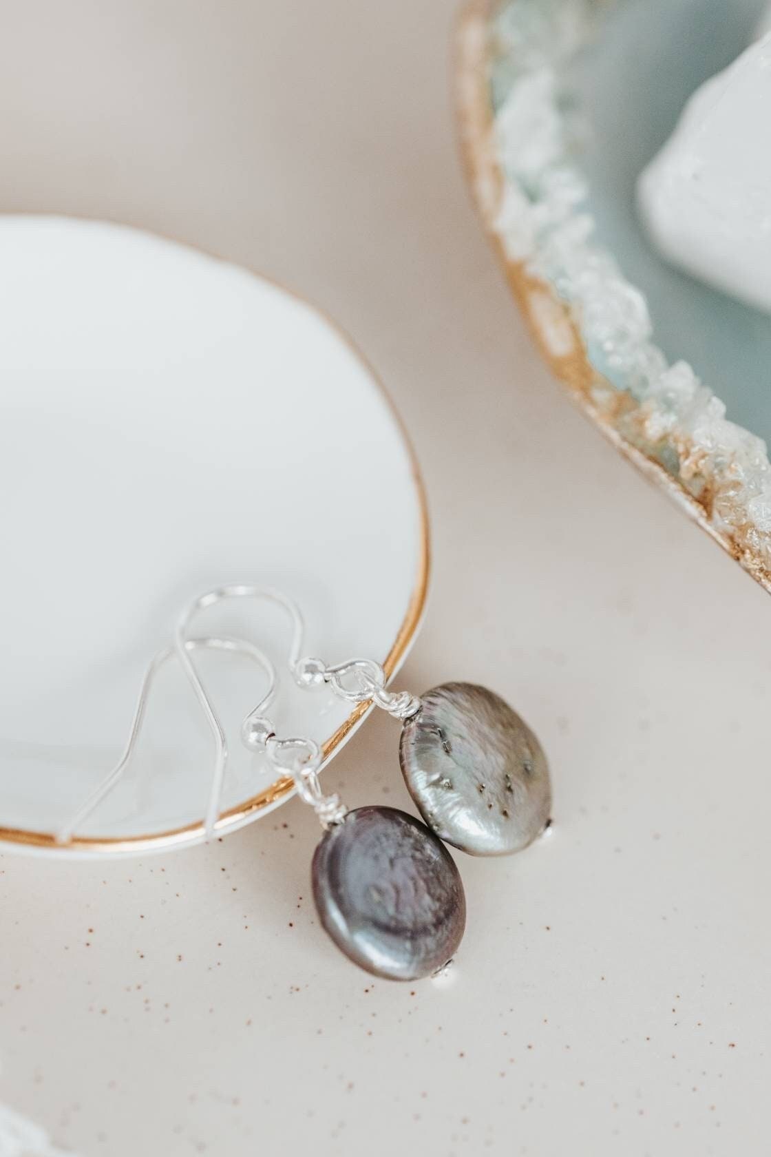 Coin shaped pearl earrings,